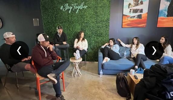 The CUENTO team gathered in a lounge area for a group discussion under the "#StayTogether" sign.