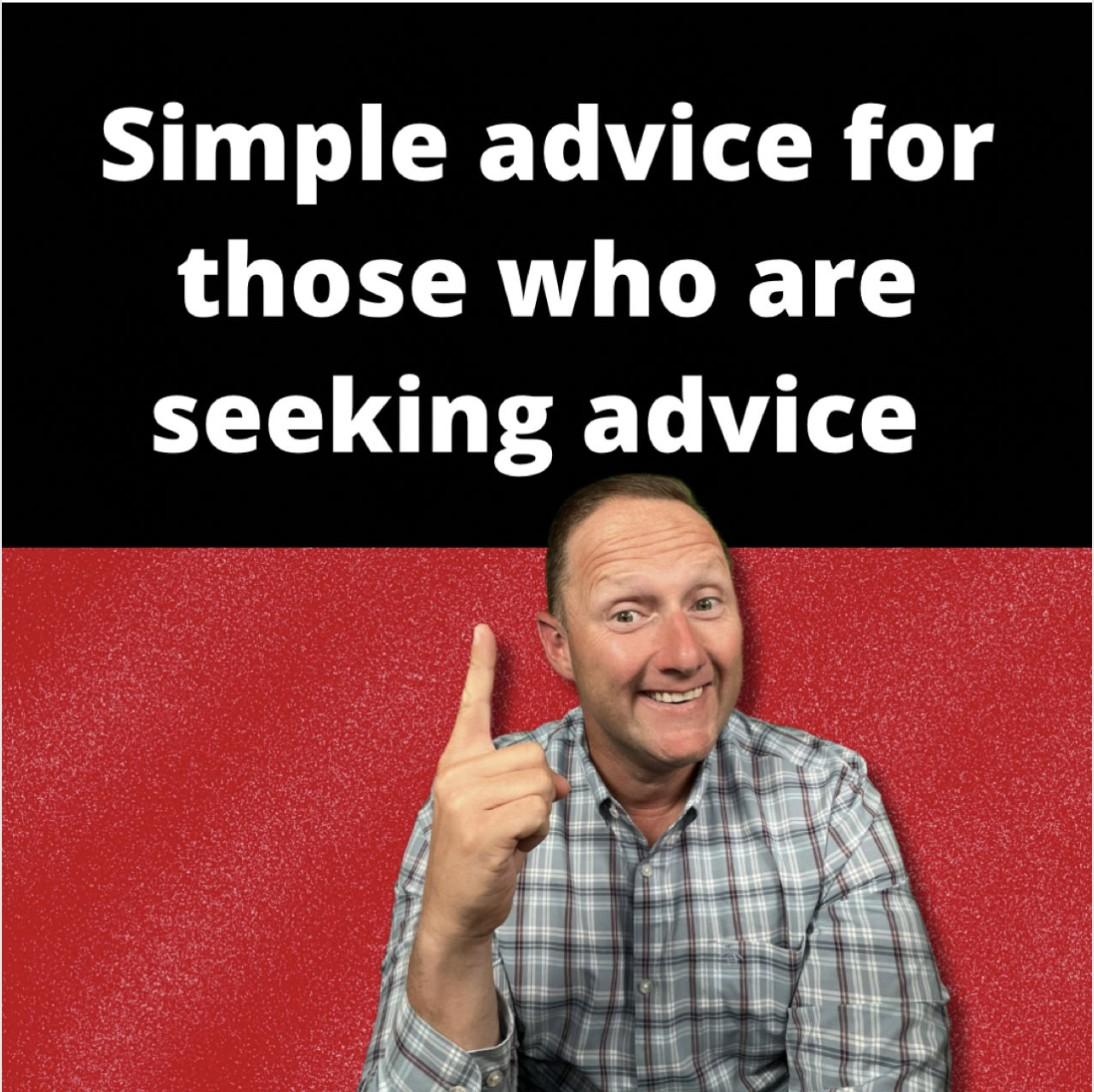 Wayne Partello points up in front of a red background beneath text reading "Simple advice for those who are seeking advice."