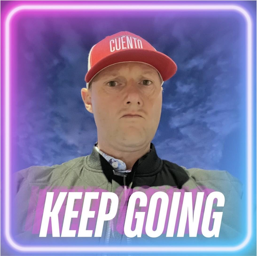 Wayne wearing a red CUENTO cap with a serious expression, inside a neon-bordered graphic reading 'KEEP GOING.'